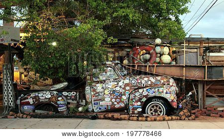 KEY WEST, FL - NOVEMBER 30, 2013: Old truck covered with bumper stickers at Bo's Fish Wagon restaurant in Key West, Florida