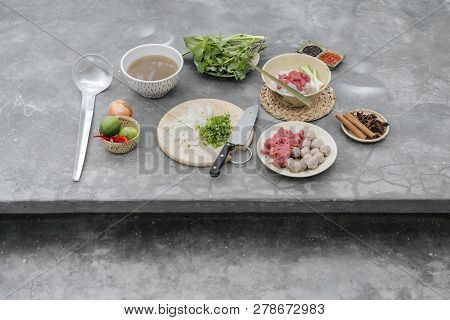 Traditional Vietnamese Soup Pho Bo With Herbs, Meat, Rice Noodles, Broth. Pho Bo In Bowl With Chopst