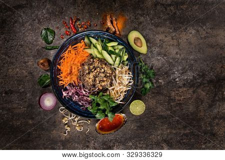 Bun bo nam bo asian food background with various ingredients on rustic stone , top view. Vietnam or Thai cuisine.