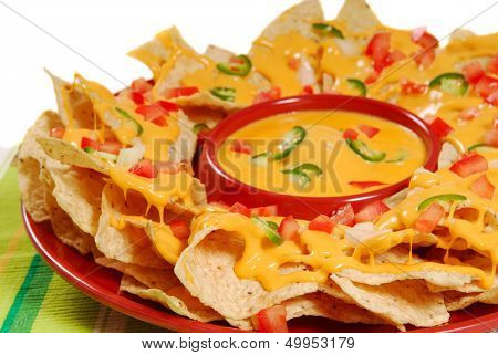 Plate of fresh nachos with a spicy jalapeno cheese sauce