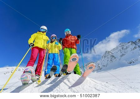 Skiing, winter, snow, skiers, sun and fun - family enjoying winter vacations