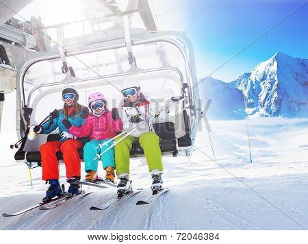 Ski, skiing - skiers on ski lift