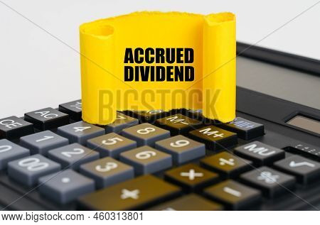 Business Concept. On The Calculator Is A Yellow, Twisted Paper Plate With The Inscription - Accrued 