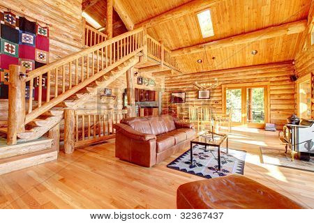 Luxury Log Cabin Living Room With Leather Sofa.