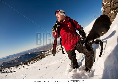 skier on a top over blue sky