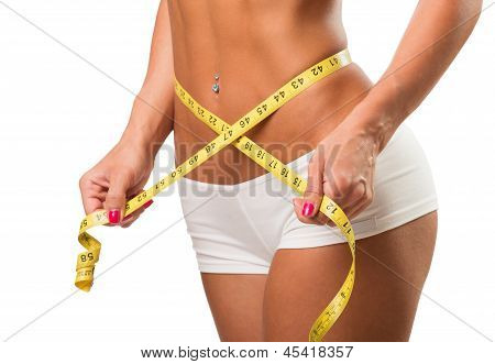 Healthy female body with measuring tape