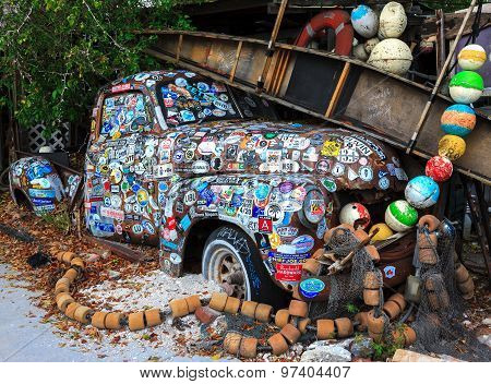 Old Car Covered With A Variety Of Stickers