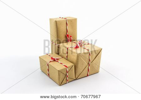 Cardboard Carton Wrapped With Brown Paper, Tied With String.