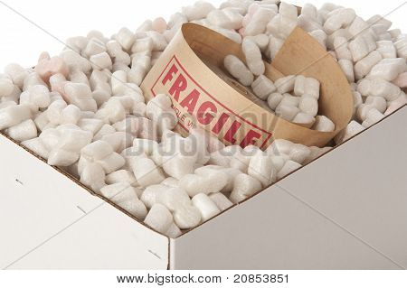 Box Of Packing Peanuts With Roll Of Fragile Tape Inside