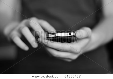 Person holding smart phone in hands to communicate and text