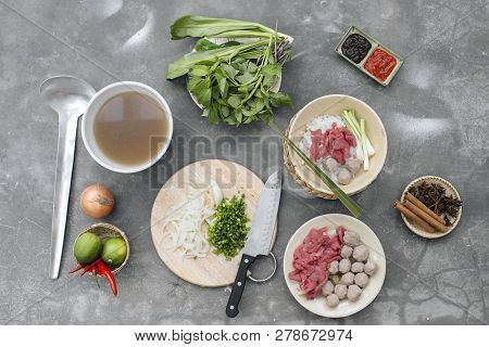 Traditional Vietnamese Soup Pho Bo With Herbs, Meat, Rice Noodles, Broth. Pho Bo In Bowl With Chopst