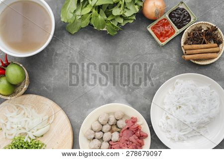 Traditional Vietnamese Noodle Soups Pho In Bowls, Concrete Background. Vietnamese Beef Soup Pho Bo, 