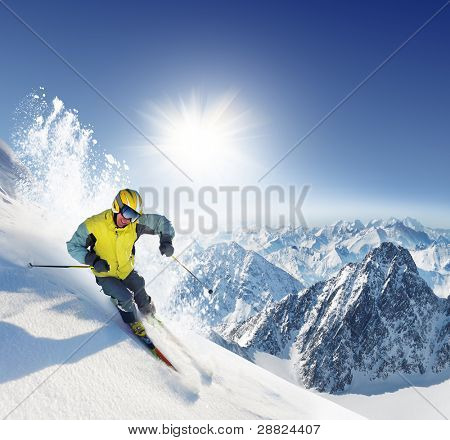 Skier in high mountains