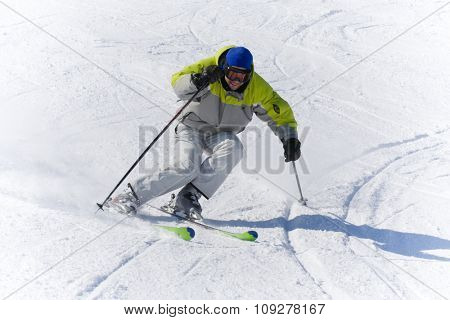 Skier on a snow slope in high speed. winter sports concept