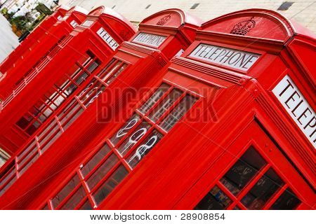 Five red phone boxes, angled composition