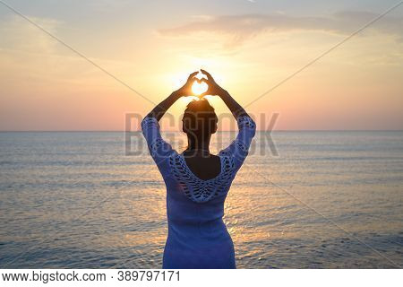 Woman Makes Heart With Hands On Beach. Happy People Lifestyle. Woman On Beach Making Heart With Hand