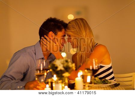 young loving couple having romantic dinner together