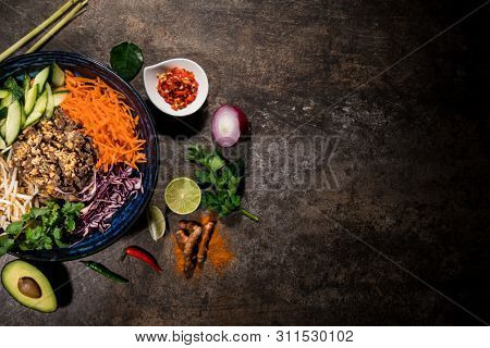 Bun bo nam bo asian food background with various ingredients on rustic stone background , top view. Vietnam or Thai cuisine.