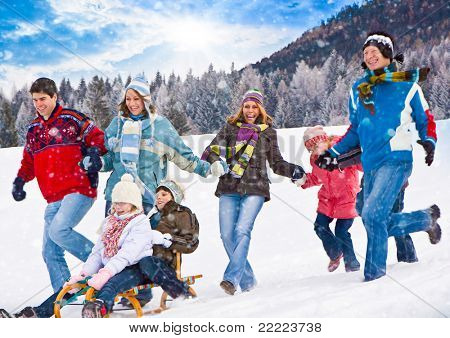 cute family having fun in the snow