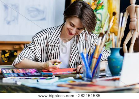 Young Beautiful Smiling Artist Teacher Student Woman Girl Boy In Art Workshop Studio Surrounded By C