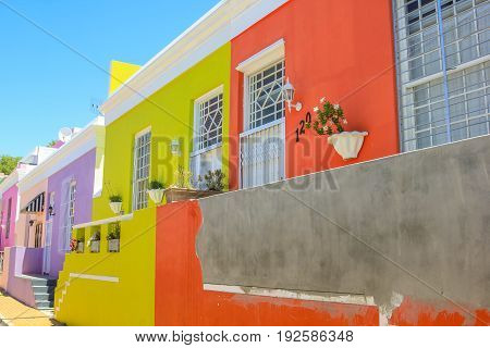 Cape Town, South Africa - January 11, 2014: The colorful houses of Bo-Kaap, famous Malay Quarter is the Muslim Malay village in Cape Town, one of the most picturesque part of town.