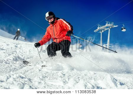 Skier Skiing On Ski Slope