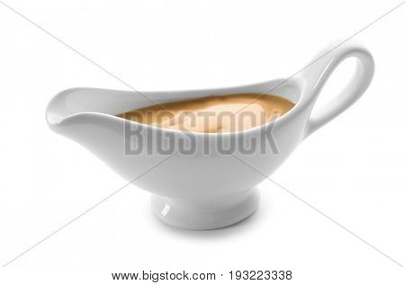 Sauce boat with turkey gravy on white background