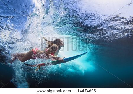 Underwater Photo Of Girl With Board Dive Under Ocean Wave