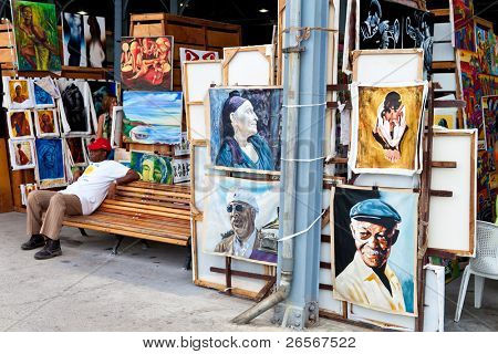 HAVANA-APRIL 2:Art market in Havana's old harbors April 2,2011 in Havana.One of Havana's tourist attractions,this fair sells paintings of iconic cuban themes and famous artistic or political figures