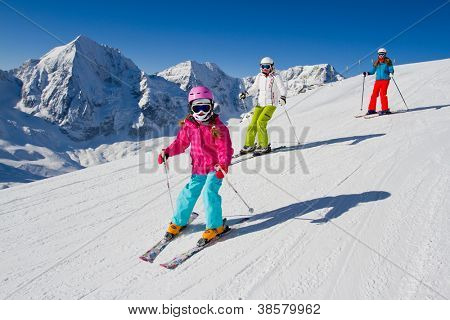 Skiing, winter, ski lesson - skiers on mountainside