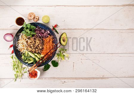 Bun bo nam bo asian food background with various ingredients on rustic wooden background , top view. Vietnam or Thai cuisine.