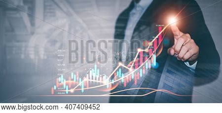 Businessman Draws Graphs Of Business Growth And Analyzes Financial And Investment Data, Planning Bus