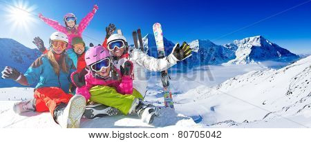 Skiing, winter, snow, skiers, sun and fun - family enjoying winter vacations