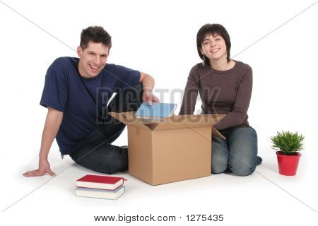 Couple Unpacking Boxes 