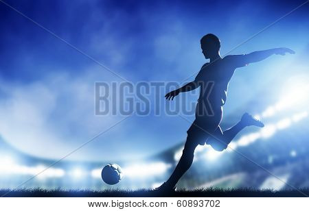 Football, soccer match. A player shooting on goal. Lights on the stadium at night.