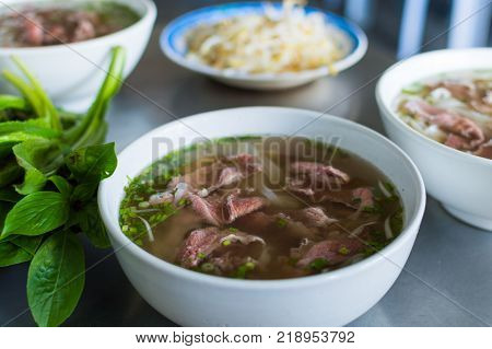 Pho Bo, plate with vietnamese soup noodle with beef