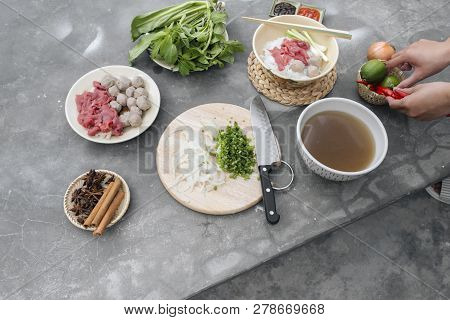 Traditional Vietnamese Soup Pho Bo With Herbs, Meat, Rice Noodles, Broth. Pho Bo In Bowl With Chopst