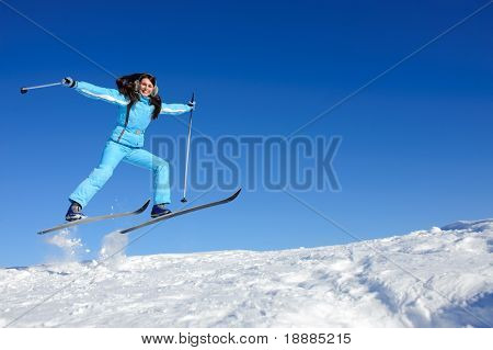 jump of happy young skier