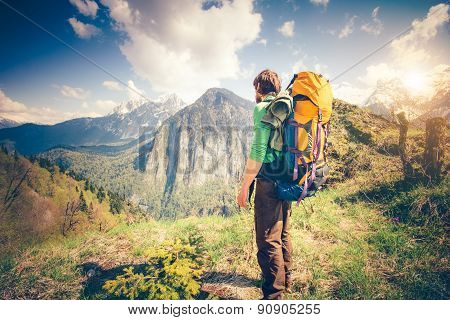 Young Man Traveler with backpack relaxing outdoor