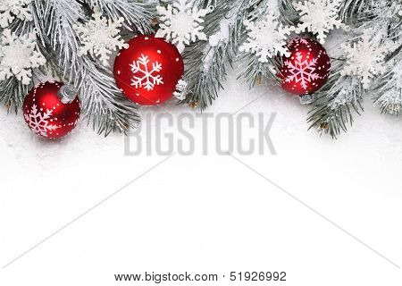 Christmas decoration with fir branch, Christmas ball and snow