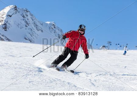 Skier Skiing On Ski Slope